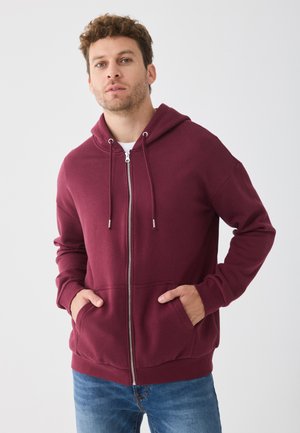 Bordeaux kleurige zip-up hoodie met een trekkoord capuchon, voor zakken en ribgebreide boorden. Gemaakt van een zachte, gestructureerde stof.