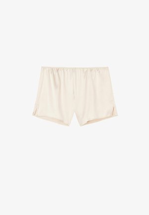 Shorts beige clair en tissu lisse et doux. Dotés d'une taille élastique et de légères fentes sur les côtés près de l'ourlet pour plus de confort.