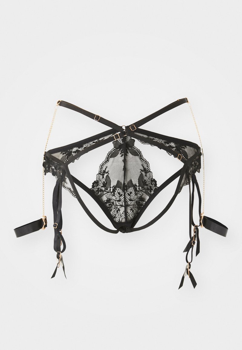 Lingerie in pizzo nero con motivo floreale, dotata di spalline in satin regolabili, dettagli in metallo dorato e lacci laterali. Presenta un design con schiena scoperta.