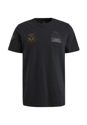 Black cotton t-shirt with short sleeves, featuring embroidered patches in gold and blue, including text and insignia on the front.