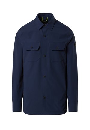 Marineblaues Hemd mit Knopfleiste, aus glattem Stoff gefertigt, mit zwei Brusttaschen, einem spitzen Kragen und einem dezenten Logo auf dem Ärmel.