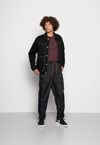 Jordan SUIT PANT - Calças cargo - black