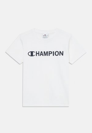 Biała bawełniana koszulka z krótkim rękawem z dużym czarnym logo "CHAMPION" z przodu. Okrągły dekolt.