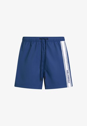 Sinine ujumispüksid kerge kangaga, millel on elastne vöökoht ja nööriga reguleeritav, valged külgtriibud ning "KARL LAGERFELD" brändimine.