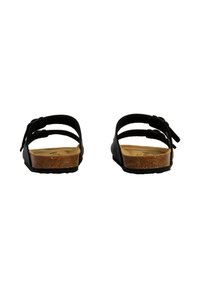 Sorte sandaler med to stropper, kork-fodbed og tekstureret gummisål, der har justerbare spænder for pasform og et fladt design.