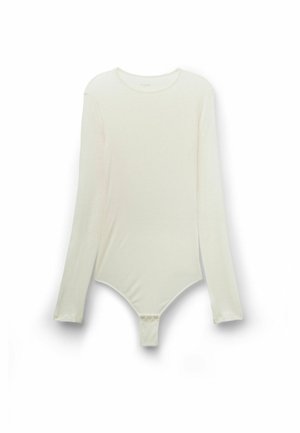 Body à manches longues en crème clair, fabriqué dans un tissu doux, avec un col rond et une fermeture par boutons-pression à l'entrejambe pour un enfilage facile.