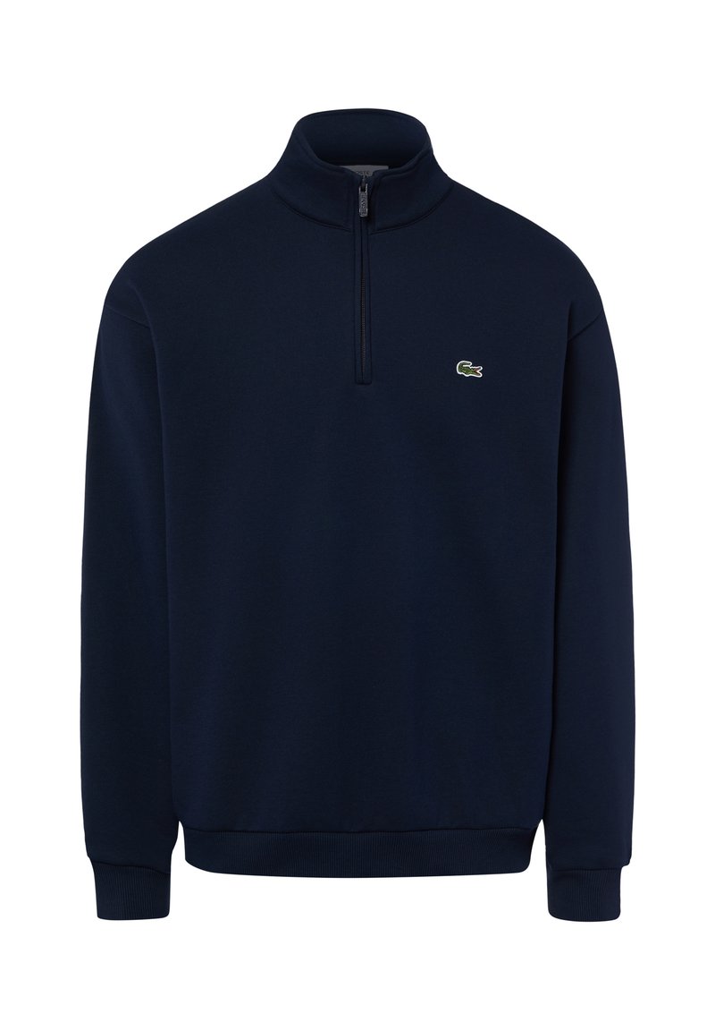 Felpa blu navy a maniche lunghe con una corta cerniera frontale e un piccolo logo verde coccodrillo sul petto sinistro.
