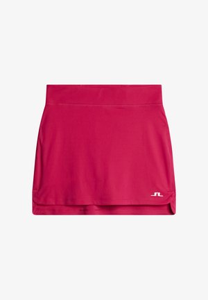 Rosa träningskjol gjord av ett mjukt, stretchigt tyg. Har ett brett elastiskt midjeband och en liten logotyp i nedre högra hörnet.