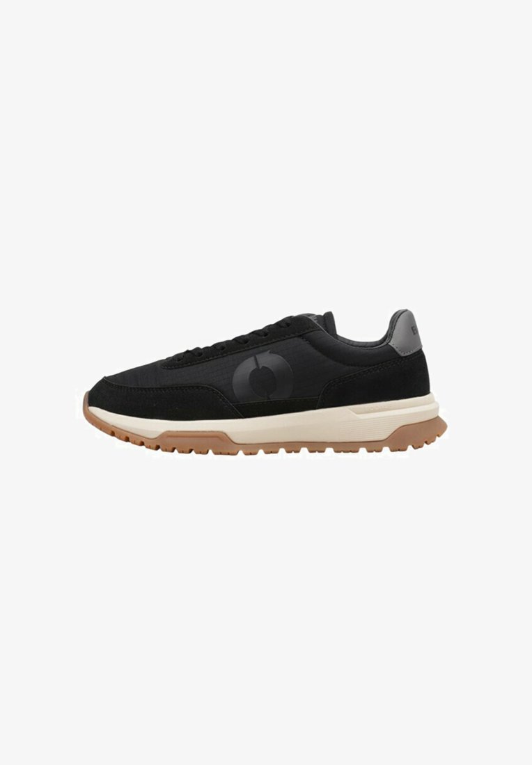 Black athletic shoes with a textured upper, featuring a black logo, cream midsole, and gum rubber outsole for traction.