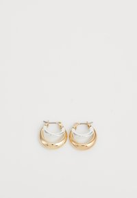 Orecchini a cerchio in oro e argento con un design bicolore, finitura lucida e forma arrotondata. Presentano una chiusura a cerniera per un indossamento sicuro.