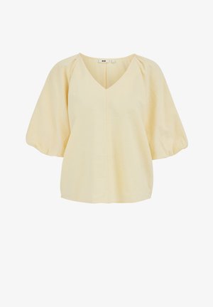 Blouse jaune clair avec col en V, manches bouffantes mi-longues aux coudes, et une coupe ample légèrement évasée.