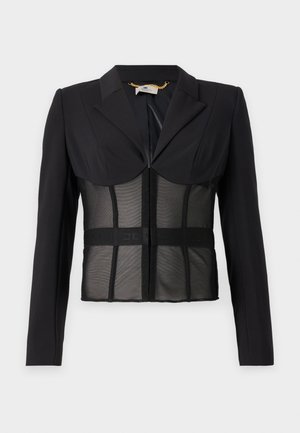Blazer structuré noir avec manches longues, un col pointu et un corsage en tissu maillé transparent. Équipé d'un bandeau élastique de marque à la taille.