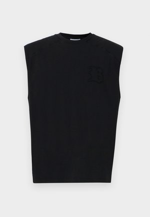 Top sans manches noir en coton avec un col rond, featuring un logo texturé sur le côté gauche à l'avant et une finition lisse.