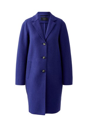 Long manteau en laine violet avec un col cranté, cinq boutons, deux poches latérales et une texture travaillée.