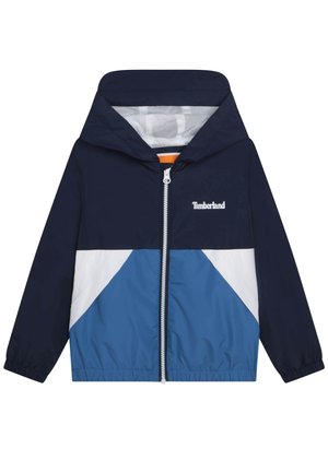 Marineblå, hvid og blå hættetrøje med lynlås foran, elastiske ærmekanter og Timberland-logo på venstre bryst.