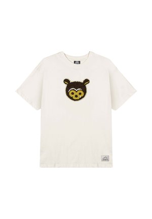 Katoenen t-shirt in roomkleur met een ontwerp van een bruine berengezicht op de voorkant. Korte mouwen, ronde hals en een klein merketiketje aan de linksonder.