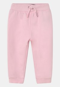 Pantaloni della tuta rosa con vita elastica e cordino regolabile. Presentano polsini a coste e una texture di tessuto liscia.
