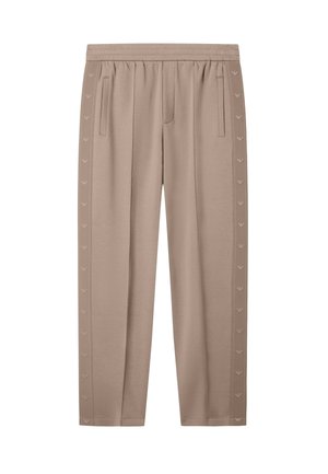 Taupefarbene Jogginghose mit elastischem Bund, seitlichen Taschen und vertikal verlaufenden, logo-musterten Streifen entlang der Außenseiten der Beine.