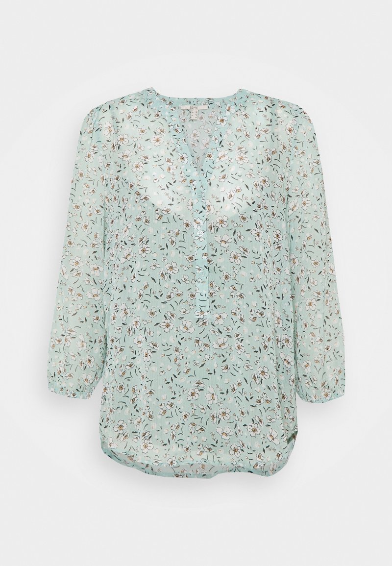 Hellgrüne Blumenbluse mit langen Ärmeln, rundem Ausschnitt und kleinen Knopfdetails vorne.