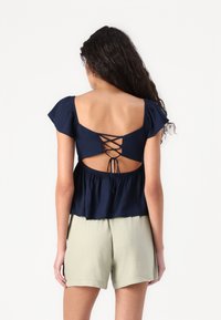 Hollister Co. Easy Flutter Sleeve Babydoll Top - Blouse - navy blazer