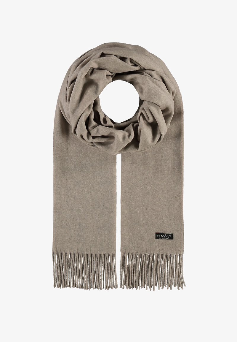 Écharpe tricotée en beige clair, présentant une texture douce et des bords frangés. Comprend une petite étiquette de marque à une extrémité.