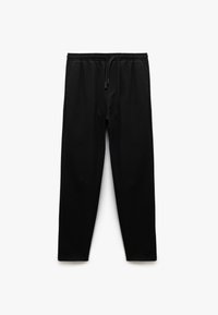 Pantalons de sport noirs avec une taille élastique, cordon de serrage et jambes fuselées. Fabriqués à partir d'un matériau lisse et léger sans motifs visibles.