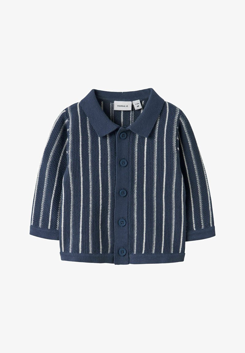 Tmavě modrý pletený dětský svetřík s bílými svislými pruhy, s dlouhými rukávy, límečkem a pěti knoflíky vpředu, velikost 1-2 měsíce.
