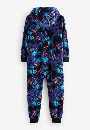 Combinaison en polaire ornée d'un motif vibrant de manettes de jeux vidéo en violet, bleu et noir, avec une capuche et des poignets élastiques.