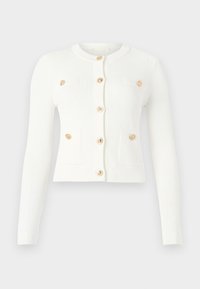 White ribbed cardigan featuring long sleeves, a round neckline, six gold buttons, and two front pockets with flap details.