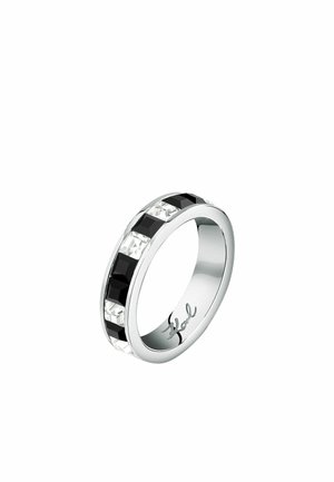 Silver-tone band ring featuring alternating black and clear rectangular crystals, polished finish, and subtle brand engraving inside.