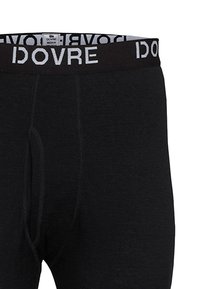 Sorte termiske lange underbukser med en strækbar talje med "DOVRE" logo. Stoffet ser blødt ud med en glat tekstur og klassisk pasform.