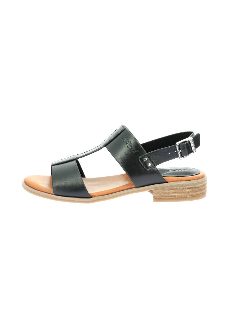 Sandale en cuir noir avec bride à la cheville, bout ouvert et talon en bois. Présente des brides croisées et une texture lisse. Design minimaliste.