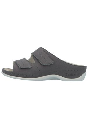 Gray slip-on sandal featuring two adjustable Velcro straps, a cut-out design, and a textured surface on a white sole.
