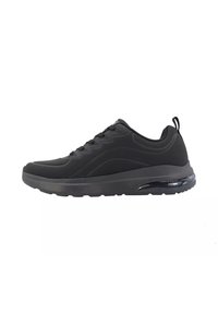 Scarpa sportiva nera con una tomaia testurizzata, chiusura con lacci e un'unità di ammortizzazione ad aria visibile nella suola. Design leggero per il massimo comfort.