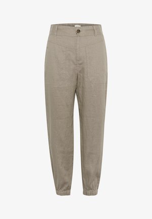 Pantaloni beige tapered in tessuto testurizzato, con chiusura a bottone, due tasche frontali e polsini elasticizzati alle caviglie.