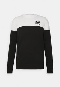Czarny i biały sweter z dzianiny z okrągłym dekoltem, z poziomym wzorem kolorowych pasów i logo "KARL LAGERFELD" w kolorze czarnym.