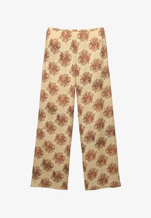 Pantaloni a gamba larga realizzati in tessuto morbido con uno sfondo beige e un motivo floreale ripetuto di colore ruggine. Vita elasticizzata per il massimo comfort.