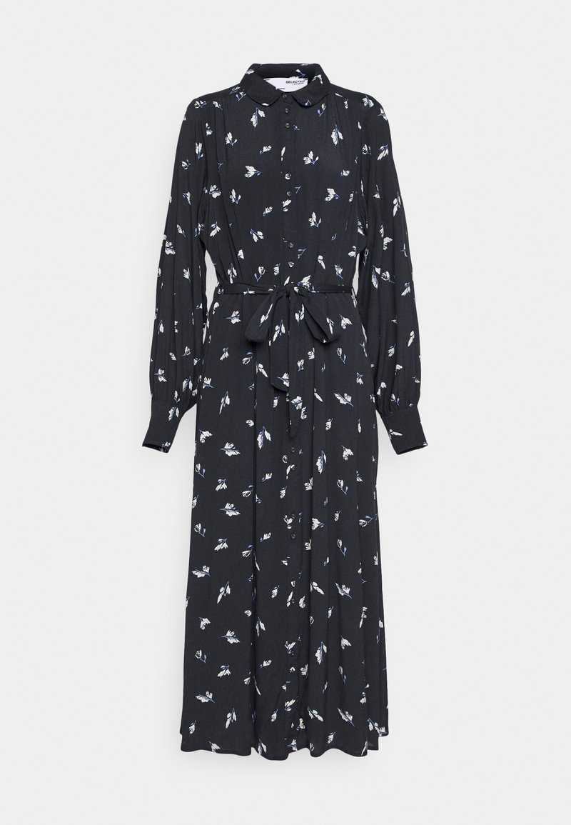 Długa czarna sukienka z kołnierzykiem, zapięciem na guziki, długimi rękawami i paskiem do wiązania. Posiada białe wzory kwiatowe. Wykonana z lekkiego materiału.
