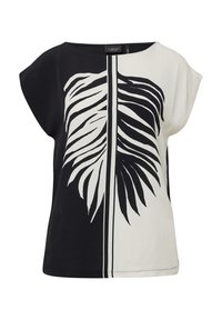 Haut à manches courtes noir et blanc présentant un grand motif de feuille, fabriqué en tissu léger avec une coupe décontractée et un col rond.
