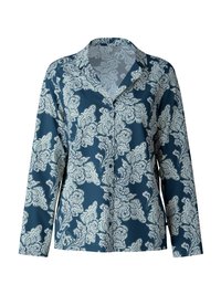 Långärmad blus i djup teal med ett vitt blommönster i paisley, med en klassisk krage och slät tygstruktur.