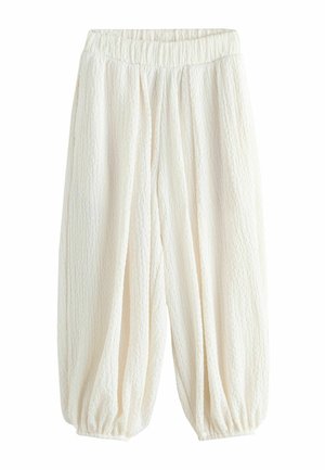 Lockere weiße, strukturierte Hose mit elastischem Bund und elastischen Bündchen an den Knöcheln, entworfen für eine entspannte und bequeme Passform.