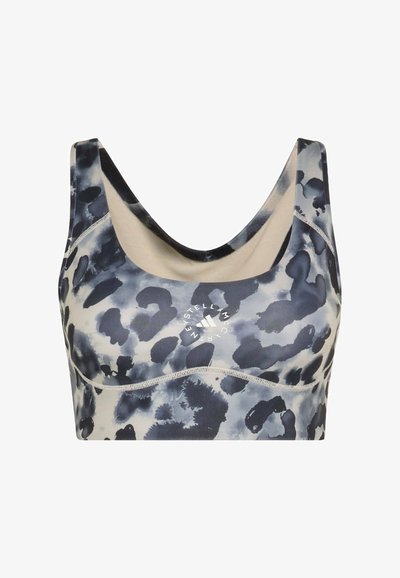 Sports bra featuring a blue, gray, and beige abstract pattern, with a scoop neckline and logo detail at the center. Stretchy material.