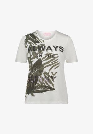 Biała koszulka z grafiką zielonych liści i nadrukiem tekstowym. Wykończona błyszczącymi akcentami, posiada okrągły dekolt oraz krótkie rękawy.