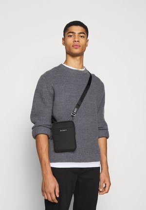 UNISEX - Cross body bag - black