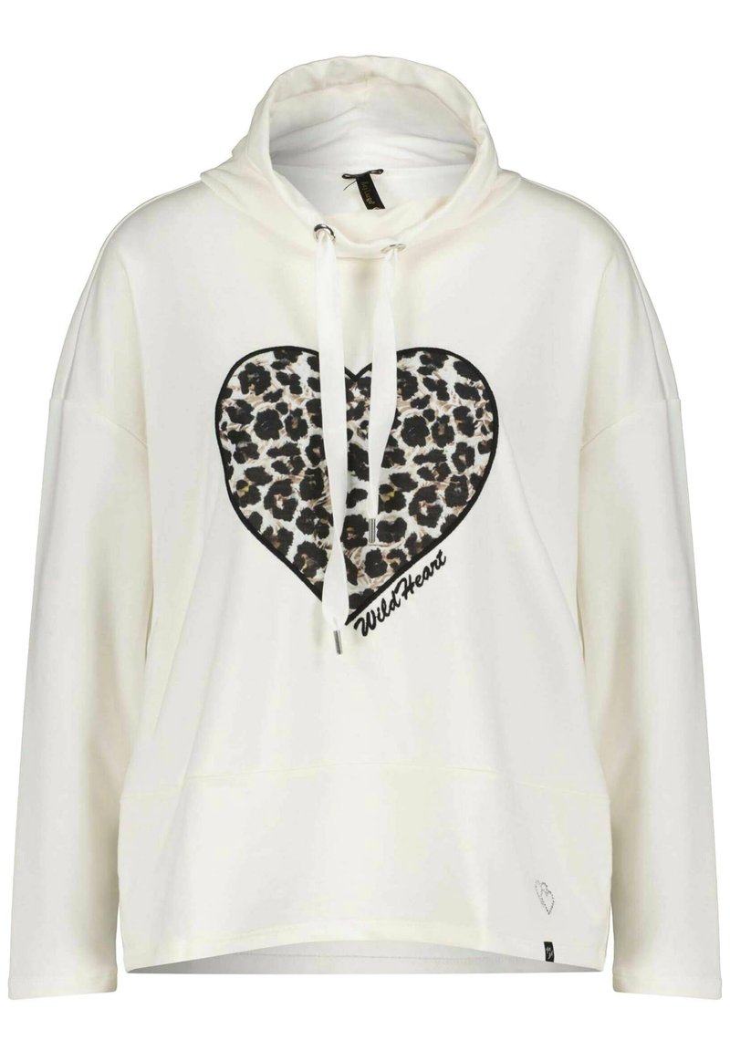 Hoodie bianco oversize con design a forma di cuore in stampa leopardata. Presenta un cappuccio con coulisse e la scritta "WildHeart" sotto il cuore. Tessuto morbido.