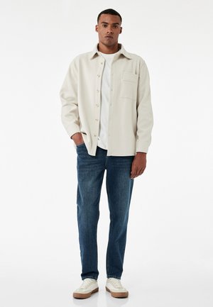 Vaqueros tapered - blue denim