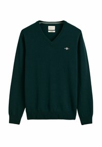 Dunkelgrüner V-Ausschnitt-Pullover aus weichem Strickstoff. Mit langen Ärmeln und einem kleinen gestickten Logo auf der linken oberen Brust.