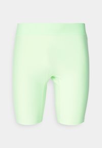 Shorts vert menthe en matériau extensible, conçus pour épouser la silhouette, avec une ceinture lisse et des côtés sans couture.