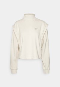 Sudadera blanca cortada con cuello alto, mangas largas y un detalle de hombro ligeramente oversize. Presenta un discreto bordado del logotipo en el pecho.