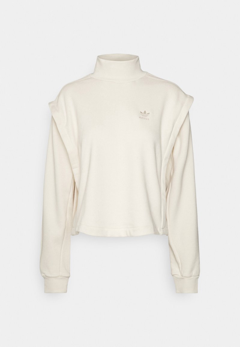 Kort wit sweatshirt met hoge hals, lange mouwen en licht oversized schouderdetails. Heeft een subtiele geborduurde logo op de borst.